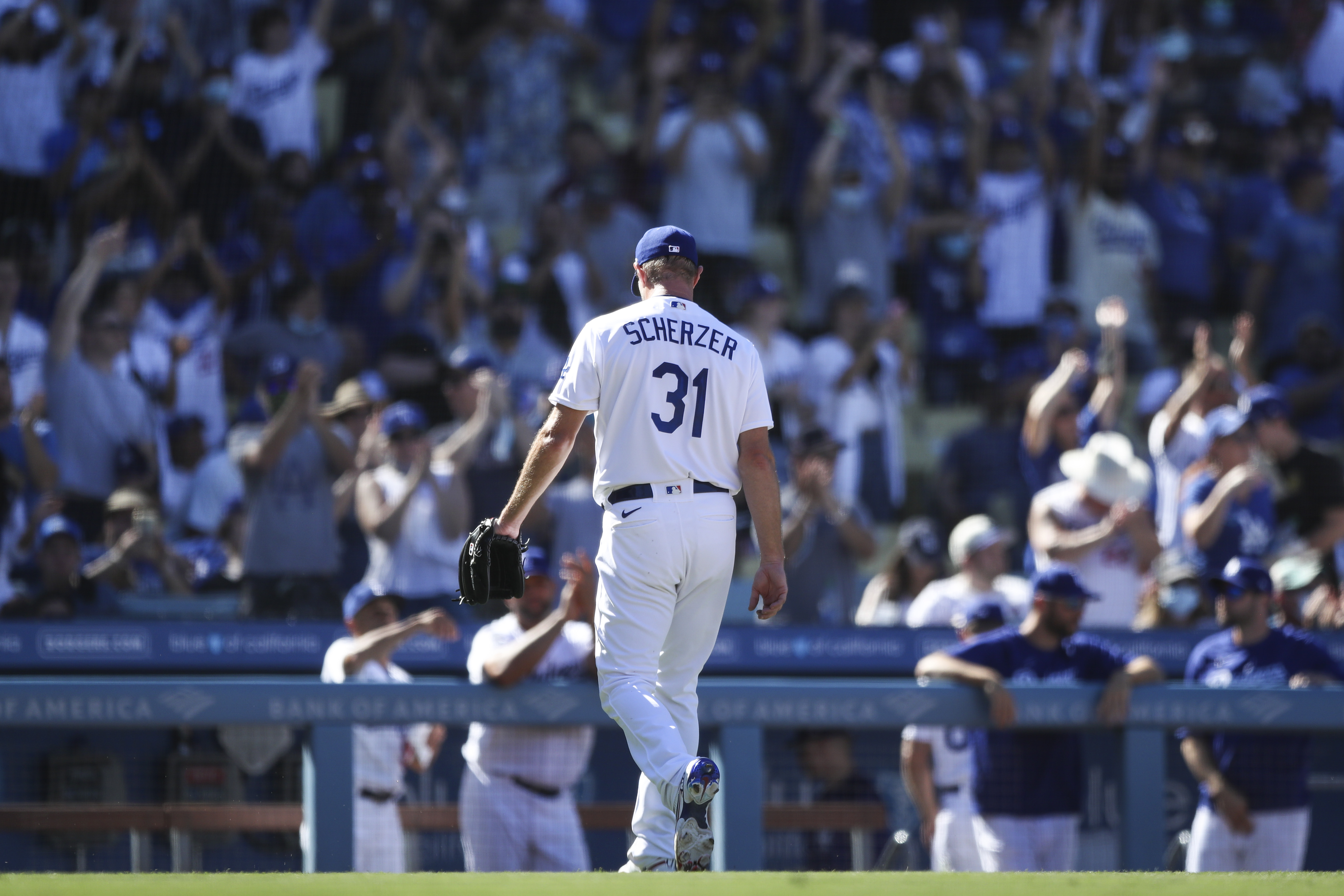 Los Angeles Dodgers pitcher Greg Maddux stretches in the dugout