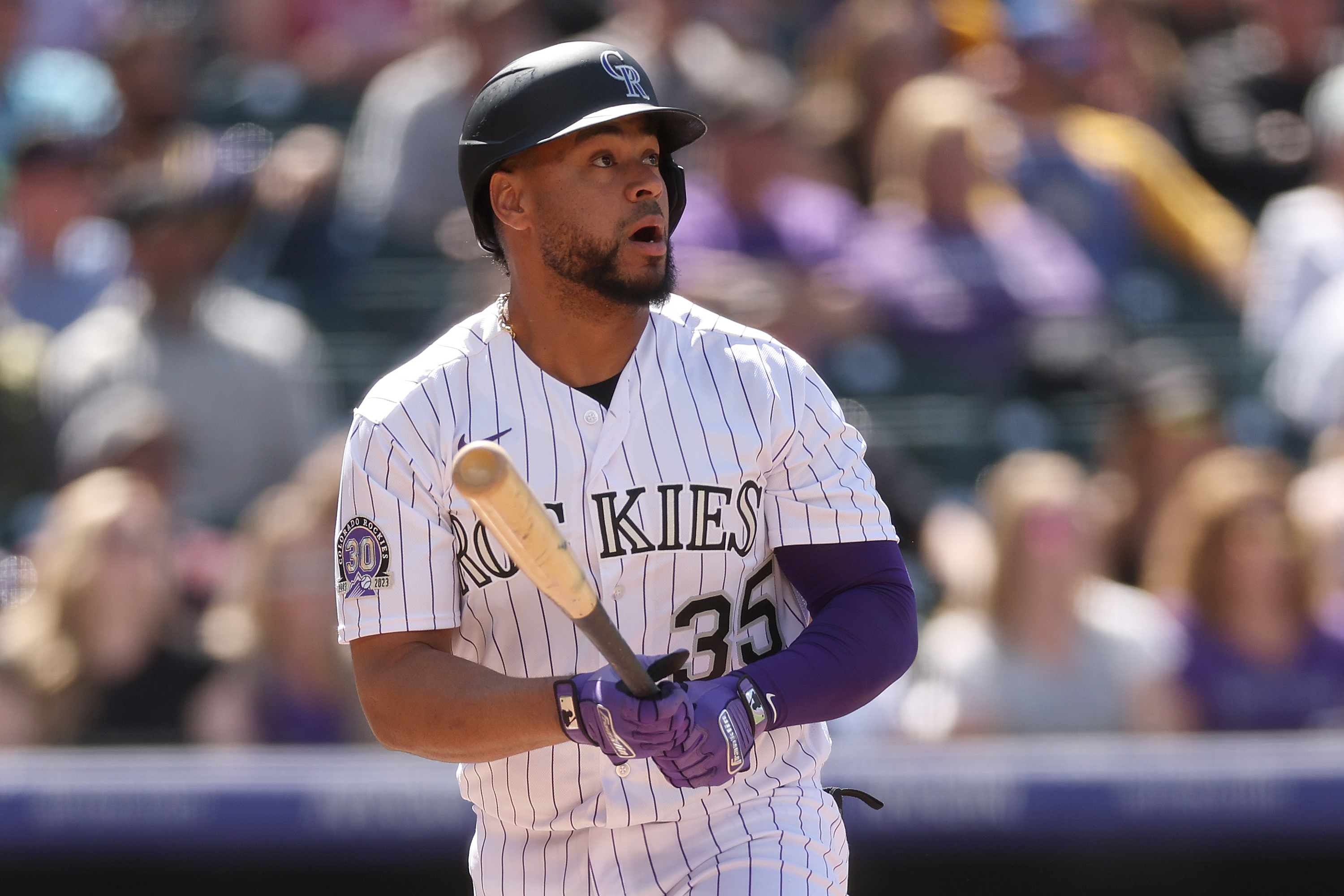 Here to help: Rockies catcher Elias Diaz extends a hand to his