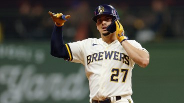 Willy Adames #27 of the Milwaukee Brewers reacts after hitting a double against the St. Louis Cardinals at American Family Field.