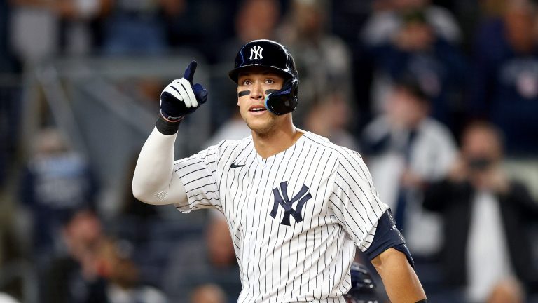 Aaron Judge of the New York Yankees celebrates his solo home run in the fifth inning against the Cleveland Guardians at Yankee Stadium.