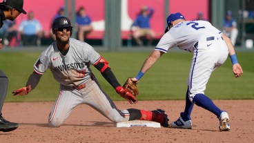 Byron Buxton of the Minnesota Twins celebrates an RBI double against Garrett Hampson of the Kansas City Royals at Kauffman Stadium.