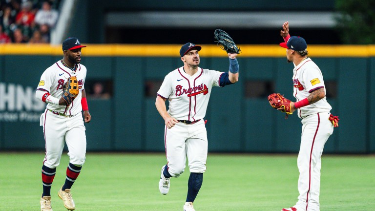 Michael Harris II #23, Orlando Arcia #11 and Adam Duvall #14 of the Atlanta Braves celebrate in the eighth inning against the Boston Red Sox at Truist Park.