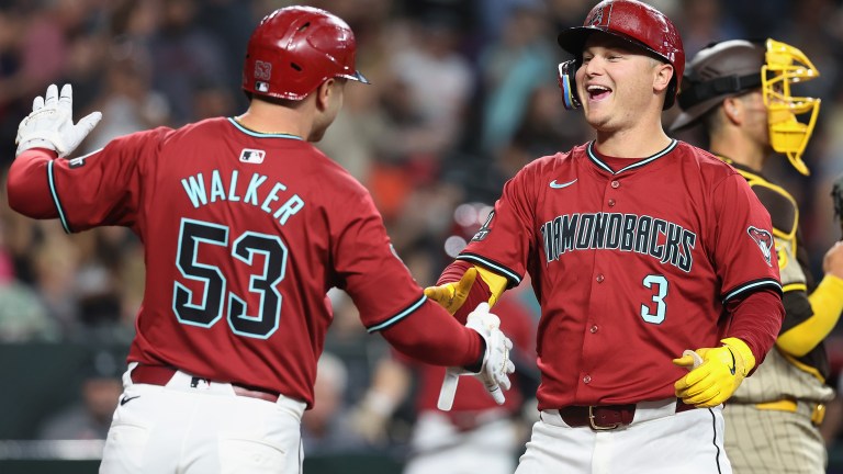 Joc Pederson of the Arizona Diamondbacks celebrates with Christian Walker after hitting a two-run home run against the San Diego Padres during the fourth inning of the MLB game at Chase Field.