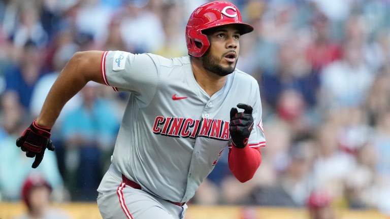 Jeimer Candelario of the Cincinnati Reds hits a double in the first inning against the Milwaukee Brewers at American Family Field.