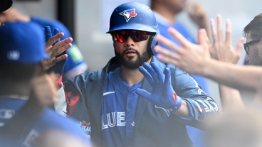 Isiah Kiner-Falefa of the Toronto Blue Jays celebrates with teammates after hitting a solo home run during the third inning against the Cleveland Guardians at Progressive Field.