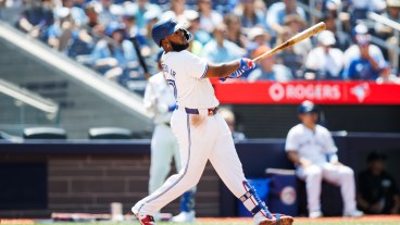 Vladimir Guerrero Jr. of the Toronto Blue Jays hits a solo home run in the third inning of their MLB game against the Texas Rangers at Rogers Centre.