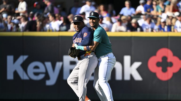 Julio Rodriguez of the Seattle Mariners hugs Framber Valdez of the Houston Astros before a game of the Astros-Mariners season series at T-Mobile Park.