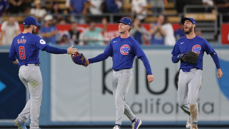 LOS ANGELES, CALIFORNIA - SEPTEMBER 10: Pete Crow-Armstrong #52 of the Chicago Cubs celebrates his game ending catch and a 6-3 win over the Los Angeles Dodgers with Ian Happ #8 and Cody Bellinger #24 at Dodger Stadium on September 10, 2024 in Los Angeles, California. (Photo by Harry How/Getty Images)