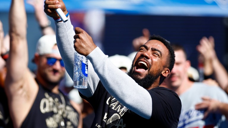 Free agent Teoscar Hernandez (then of the Los Angeles Dodgers) celebrates during the 2024 World Series Celebration Show at Dodger Stadium.